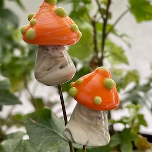 Lampwork glass mushroom toadstool with orange cap and green dots by Glass Art Revealed