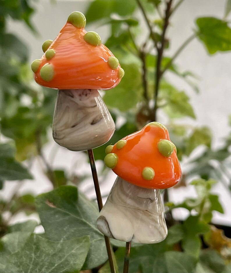 Lampwork glass mushroom toadstool with orange cap and green dots by Glass Art Revealed