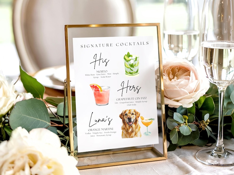 May include: A gold framed sign displays a cocktail menu with watercolor illustrations. The menu includes a Mojito, a Grapefruit Gin Fizz, and an Orange Martini. The sign is surrounded by flowers and glasses of champagne.
