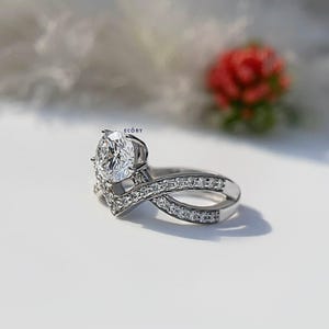 Elegant 1.10 CT round lab grown diamond engagement ring paired with a 14K gold criss cross wedding band. Featuring dazzling D-E color and VVS-VS clarity, this handcrafted sustainable ring is perfect for proposals, anniversaries, weddings, or heirloom gifts. Ethically made fine jewelry that blends modern style with timeless beauty. Ideal for eco-conscious brides seeking conflict-free diamond rings.
