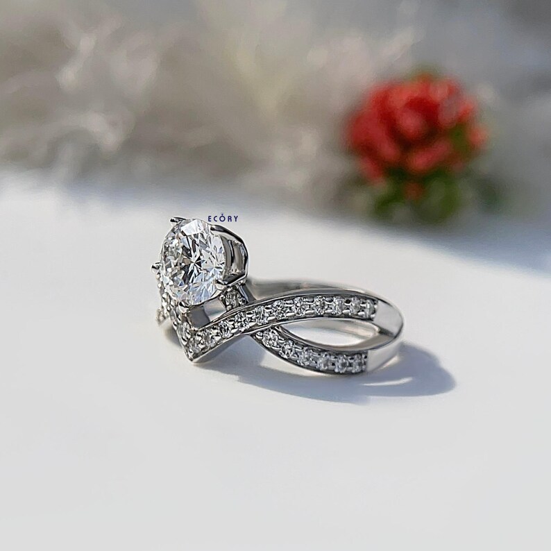 Elegant 1.10 CT round lab grown diamond engagement ring paired with a 14K gold criss cross wedding band. Featuring dazzling D-E color and VVS-VS clarity, this handcrafted sustainable ring is perfect for proposals, anniversaries, weddings, or heirloom gifts. Ethically made fine jewelry that blends modern style with timeless beauty. Ideal for eco-conscious brides seeking conflict-free diamond rings.