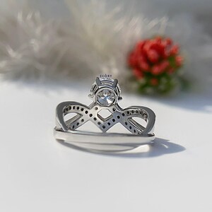 Elegant 1.10 CT round lab grown diamond engagement ring paired with a 14K gold criss cross wedding band. Featuring dazzling D-E color and VVS-VS clarity, this handcrafted sustainable ring is perfect for proposals, anniversaries, weddings, or heirloom gifts. Ethically made fine jewelry that blends modern style with timeless beauty. Ideal for eco-conscious brides seeking conflict-free diamond rings.