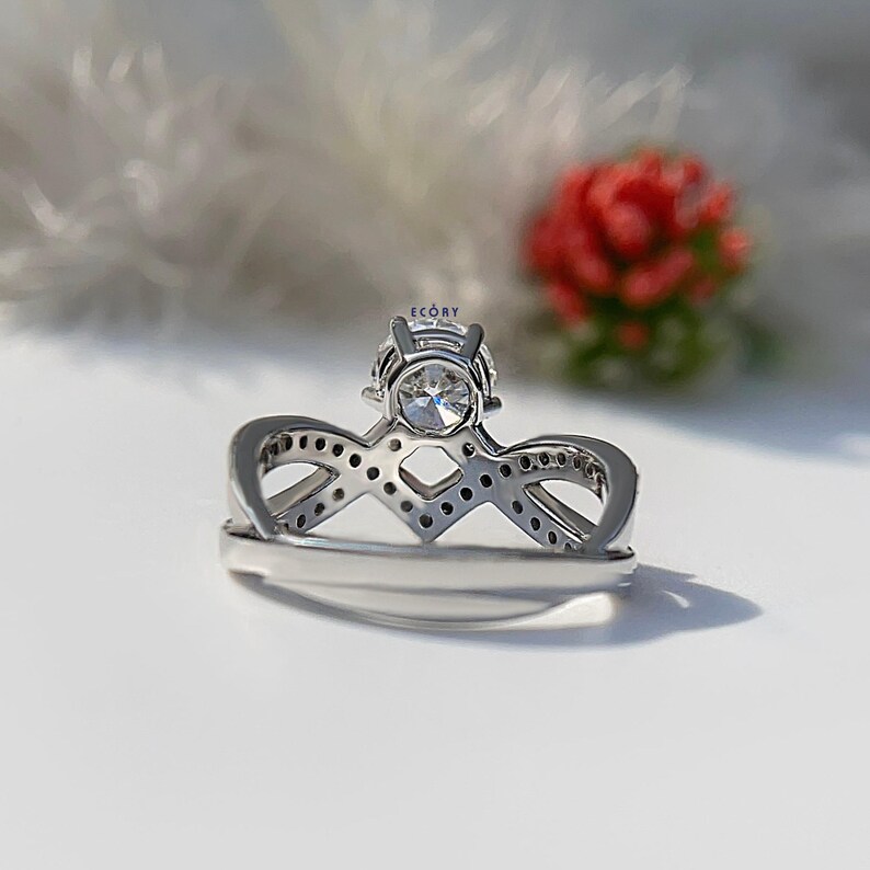 Elegant 1.10 CT round lab grown diamond engagement ring paired with a 14K gold criss cross wedding band. Featuring dazzling D-E color and VVS-VS clarity, this handcrafted sustainable ring is perfect for proposals, anniversaries, weddings, or heirloom gifts. Ethically made fine jewelry that blends modern style with timeless beauty. Ideal for eco-conscious brides seeking conflict-free diamond rings.