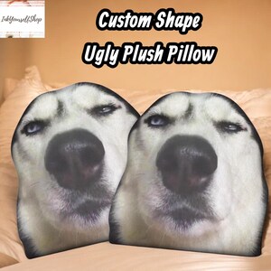 two identical dog faces, with the text "Custom Shape Ugly Plush Pillow" overlaid on the image.