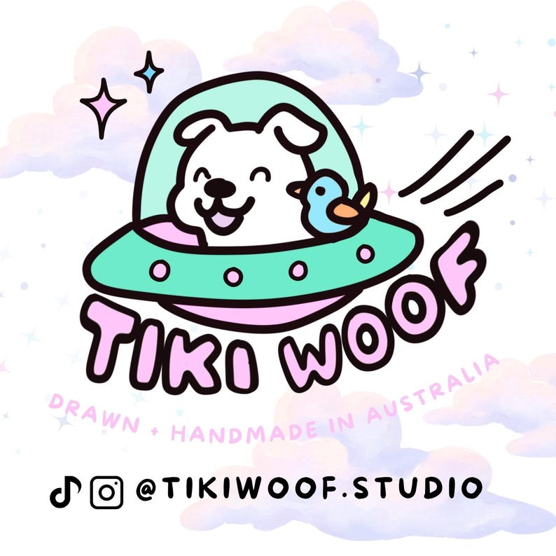 May include: A whimsical illustration features a smiling white dog in a teal UFO with a small blue bird. The words "TIKI WOOF" are in pink, with the text "DRAWN + HANDMADE IN AUSTRALIA" below. Social media handles are also included.
