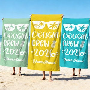 May include: Three beach towels in green, yellow, and blue, each displaying the text "Cousin Crew 2026" and "Your Name" in white. The design features sunglasses, palm trees, and a pineapple.