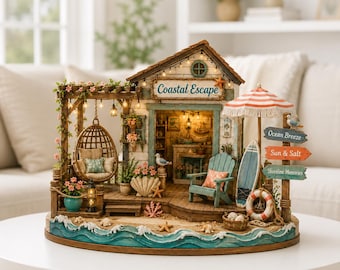 May include: A miniature beach house model titled Coastal Escape featuring a hanging rattan chair, a teal Adirondack chair, a surfboard, and a striped umbrella. The structure includes signs reading Ocean Breeze, Sun & Salt, and Shoreline Memories.