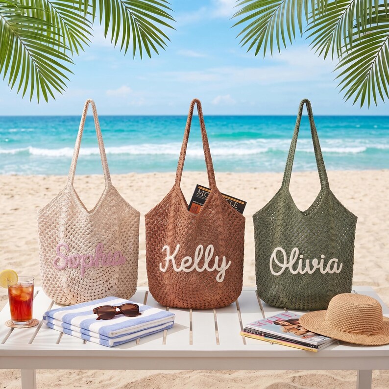 May include: Three woven tote bags in beige, brown, and olive green, each with a name embroidered on the front: Sophia, Kelly, and Olivia. The bags are on a white table with beach accessories, including a towel, sunglasses, and a straw hat.