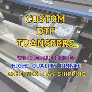 May include: A large Mimaki printer is shown, with the text "CUSTOM DTF TRANSFERS" in yellow. Additional text includes "WHOLESALE PRICES" and "HIGH QUALITY PRINTS". The machine is printing a design on a roll of material.
