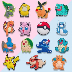 May include: A collection of colorful cartoon character charms in various shapes and sizes. The charms feature a variety of creatures in shades of yellow, orange, blue, green, and pink. A red and white Pokeball charm is also included.