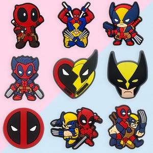 May include: A collection of colorful cartoon character shoe charms featuring Deadpool, Wolverine, and Spider-Man. The charms are in various poses and designs, with vibrant red, yellow, blue, and black colors. The collection includes a heart-shaped charm.