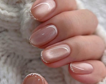 Soft Nude Short Nails with Subtle Glitter French Tips – Glossy Minimal Everyday Manicure