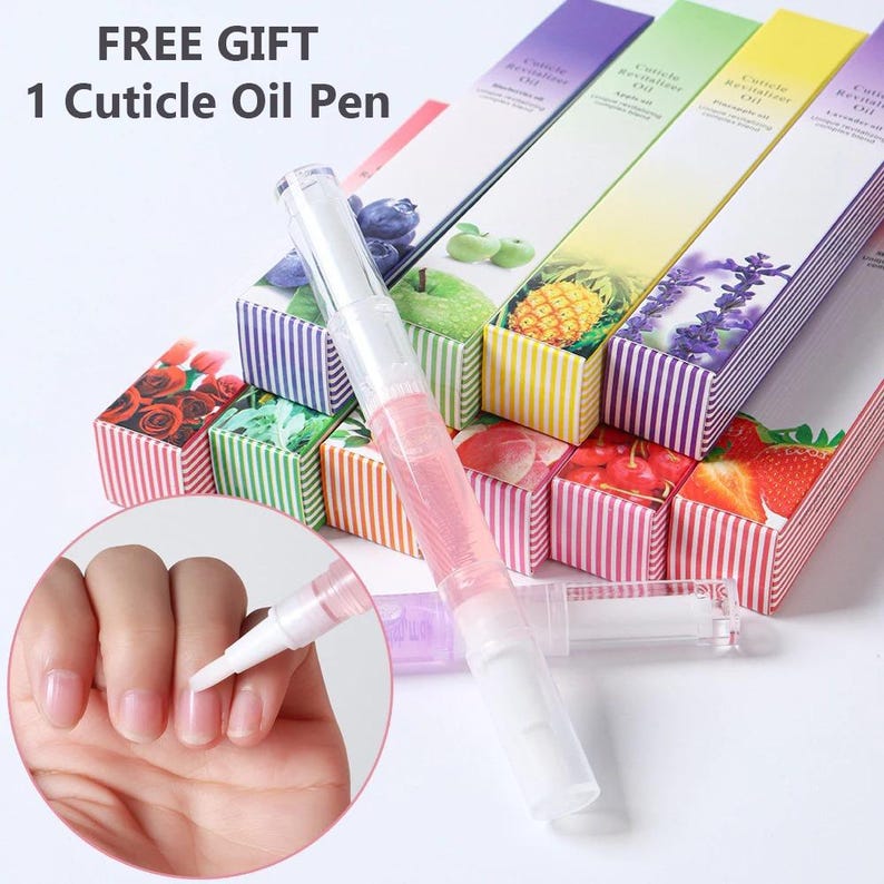 May include: A clear cuticle oil pen with pink liquid is featured in this image, alongside several boxes with colorful fruit and floral designs. The boxes are labeled "Cuticle Revitalizer Oil" and the text "FREE GIFT 1 Cuticle Oil Pen" is visible.