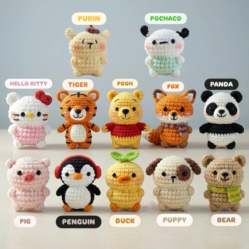 May include: A collection of twelve crocheted stuffed animals, each with a unique design. Characters include Hello Kitty, Winnie the Pooh, a panda, a fox, a tiger, a penguin, a duck, a puppy, a bear, and other cartoon characters. Each figure is labeled with its name.