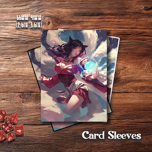 May include: Card sleeves featuring a fantasy illustration of a woman with dark hair and cat ears, holding a glowing blue orb. The sleeves are 2.6 x 3.6 inches (66mm x 91mm). The text "Card Sleeves" is at the bottom.