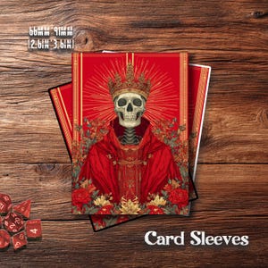 May include: Card sleeves featuring a skeletal figure in a red robe and gold crown. The image includes the text "Card Sleeves" and dimensions of 2.6 x 3.6 inches. The design has a religious theme with floral accents.