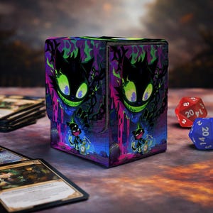 May include: A square deck box featuring a vibrant graphic of a black cat with glowing green eyes and a wide grin, surrounded by purple and pink abstract patterns. The design includes a smaller cat figure holding a pocket watch at the bottom.
