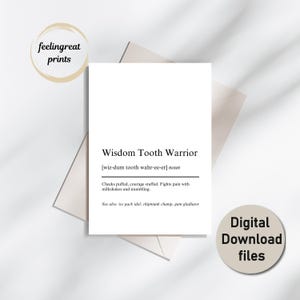 May include: A white card with the text "Wisdom Tooth Warrior" and a definition. The card is on a white surface with a beige envelope and a circular sticker that says "Digital Download files". The words "feelingreat prints" are in a circular sticker.
