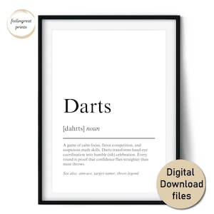 May include: A framed print with the word "Darts" in a bold font, accompanied by a definition. The print is in black and white, with the text "Digital Download files" on a circular sticker.