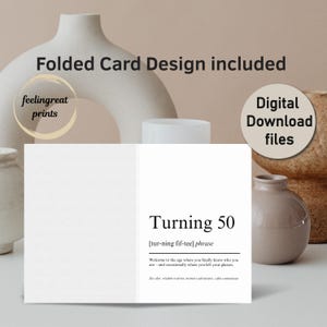May include: A white folded card with the text "Turning 50" and the phrase "[tur-ning fif-tee] phrase". The card includes the text "Welcome to the age where you finally know who you are - and occasionally where you left your glasses."