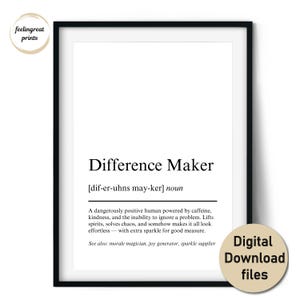 May include: Black framed print with the text "Difference Maker" in a modern font. The definition includes the phrase "dangerously positive human powered by caffeine." A circular sticker reads "Digital Download files."