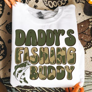 May include: A set of three ceramic mugs with a speckled, matte finish. The mugs are in shades of cream, light gray, and dark gray. Each mug has a simple, minimalist design, perfect for coffee or tea.