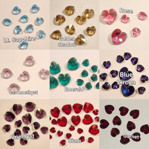 May include: Assortment of heart-shaped crystal beads in various colors, including light sapphire, golden shadow, rose, light amethyst, emerald, blue zircon, amethyst, and siam.