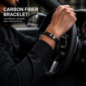 May include: A black carbon fibre bracelet with a smooth, metallic silver accent band. The text on the image reads: CARBON FIBER BRACELET. LIGHTWEIGHT. MODERN. BUILT FOR EVERYDAY. The bracelet features a woven texture and a sleek, polished finish.