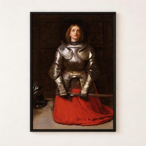Joan of Arc by Millais poster, young woman in armour kneeling in prayer with a sword