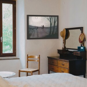 May include: A rectangular framed wall art print featuring a monochromatic landscape illustration of a figure playing a flute, surrounded by animals under a bright moon, with long shadows cast across the ground and dark tree silhouettes.