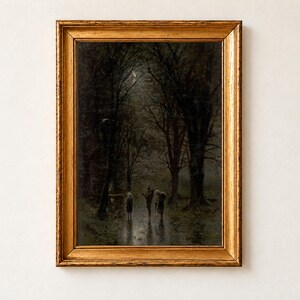 Night Travellers at a Cross by Laszlo Mednyanszky as a framed print in an antique gold frame on a cream wall. Three cloaked figures walk along a wet, moonlit road through a dark forest of tall bare trees, their reflections shining on the path.