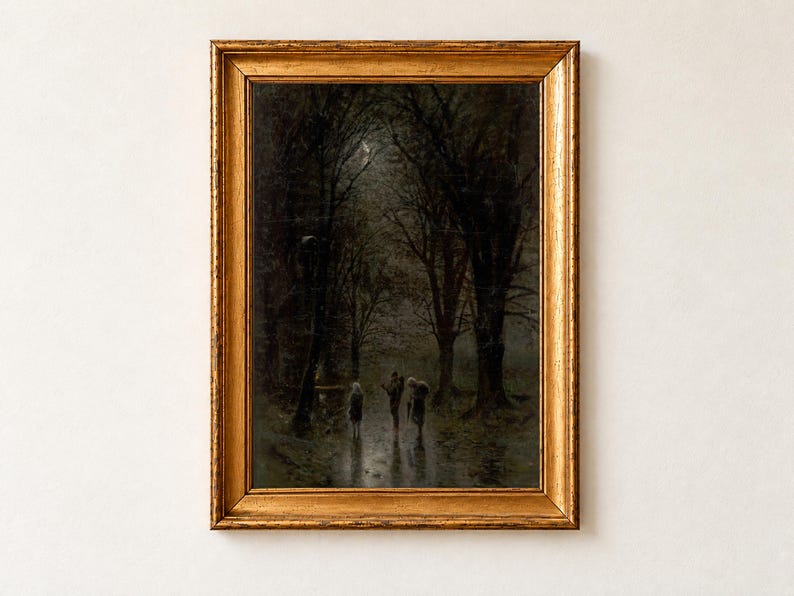 Night Travellers at a Cross by Laszlo Mednyanszky as a framed print in an antique gold frame on a cream wall. Three cloaked figures walk along a wet, moonlit road through a dark forest of tall bare trees, their reflections shining on the path.