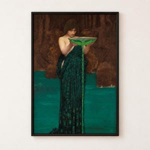 May include: A framed art print depicting a figure with dark hair wearing a long, dark green dress. The figure holds a shallow bowl filled with a vibrant green liquid that pours downward in a thin stream into a pool of matching green water.