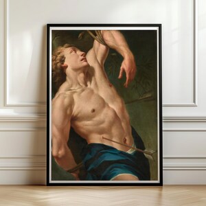 Baroque Saint Sebastian Martyr painting in a black frame on a paneled wall