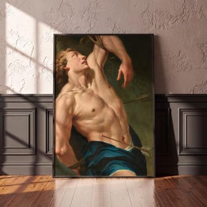 Baroque Saint Sebastian Martyr painting in a black frame on a textured wall