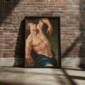 Saint Sebastian Martyr painting in a black frame on a brick wall