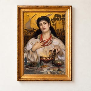 Medea by Frederick Sandys, 1868, as a framed print in a black frame on a cream wall. A dark-haired woman in a white robe and coral necklaces pours a potion into a glowing brazier, with the ship Argo and the Golden Fleece painted on a gold background behind her.