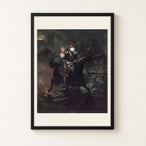 The Ballad of Lenore by Horace Vernet, 1839, as a framed print in a black frame on a cream wall. A skull-faced knight in armour gallops a black horse through a graveyard at night, a young woman in a white blouse clinging behind him, shown with a warm off-white border.