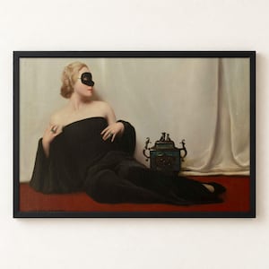 A framed oil painting depicting a blonde figure wearing a black domino mask and a long black gown, reclining on a red surface. Beside the figure sits a small, ornate, dark-coloured decorative vessel with metallic handles.