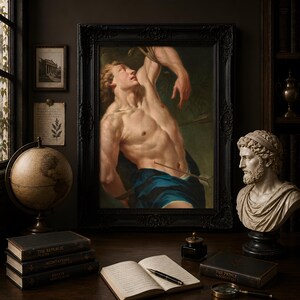 Saint Sebastian Martyr painting in an ornate dark frame on a desk with books and a globe