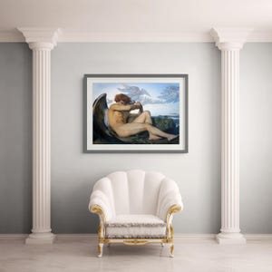 May include: A framed art print depicting a reclining figure with large dark wings, red hair, and a pale complexion, set against a mountainous landscape. The artwork is displayed in a dark gray frame on a wall between two white classical columns.