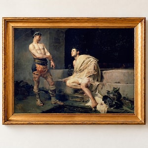 Gladiators after the Combat by José Moreno Carbonero, 1882, as a framed print in a gold frame. Two gladiators rest in a dim stone passage, one standing by an inscribed pillar and one seated on the steps with a pale cloth around his shoulders.
