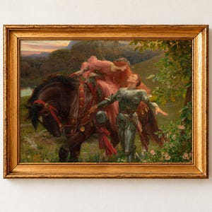 La Belle Dame sans Merci by Frank Dicksee, about 1902, as a framed print in an antique gold frame on a cream wall. A red-haired woman in a pink gown leans down from a dark horse towards a knight in armour who walks beside her through a flowering meadow.