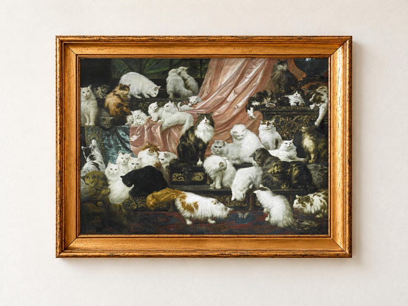 My Wife's Lovers by Carl Kahler, 1891, as a framed print in an antique gold frame. Dozens of long-haired white, grey, tabby and ginger cats lounge across rose silk drapery, cushions and a carved dark chest above a patterned rug.