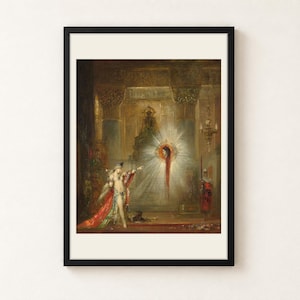 May include: A framed art print featuring a painting of a figure in red and green robes pointing toward a glowing, radiant head suspended in the air within a dark, ornate architectural interior with golden pillars and hanging lamps.