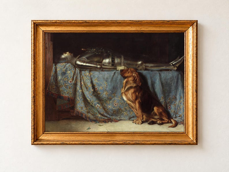 Requiescat by Briton Riviere, 1888, as a framed print in an antique gold frame on a cream wall. A bloodhound sits in mourning beside the body of a knight in full armour, laid out on a blue embroidered cloth.