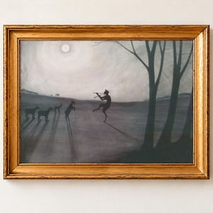 Faun by Moonlight by Leon Spilliaert, 1900, as a framed print in an antique gold frame on a cream wall. A horned faun plays a pipe as it dances across a misty, moonlit plain beside bare trees, in soft greys and silver.