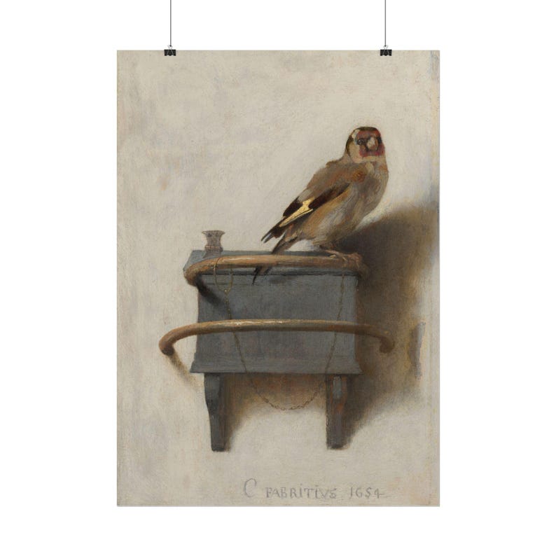May include: An oil painting of a goldfinch perched on a grey wooden box with a curved metal perch. The bird has brown, white, and yellow feathers. A thin chain is attached to the box. The text C FABRITIVS 1654 is visible at the bottom.