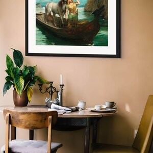 May include: A framed art print depicting a scene of a person in a green tunic standing in a wooden boat with a white horse, drinking from a horn. The boat is on water near rocky cliffs under a blue sky. The print is in a black frame.