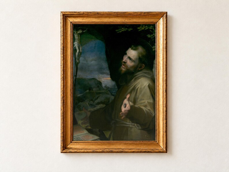 Saint Francis of Assisi by Federico Barocci as a framed print in an antique gold frame on a cream wall. The bearded saint in a brown habit gazes up towards a crucifix, his hand raised to show the wound of the stigmata, before a rocky landscape at dusk.